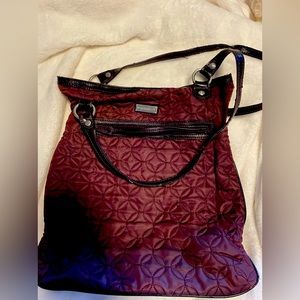 Vera Bradley plum colored purse. Handles are frayed as pictured.